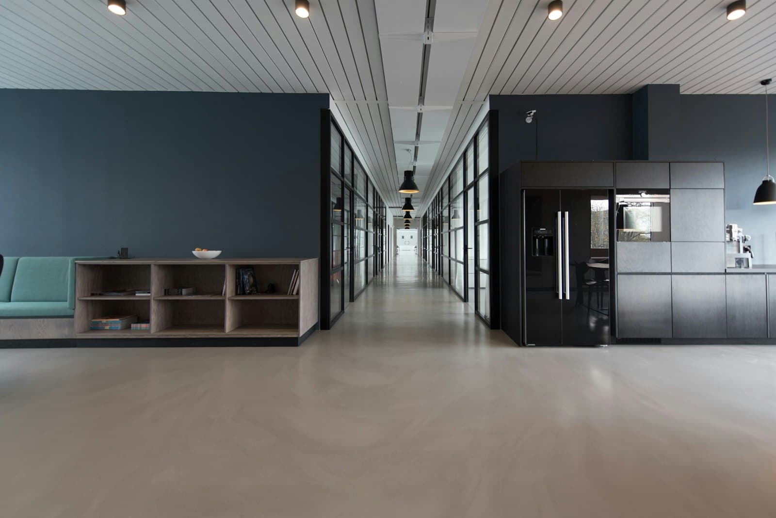 Finished interior corridor with a large floor area