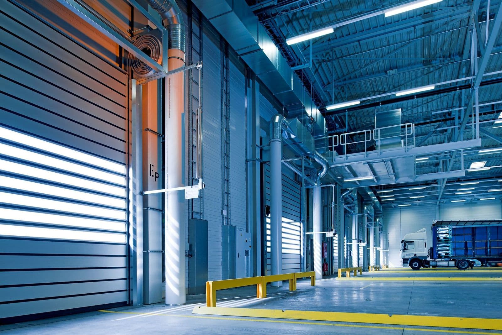 Industrial interior with loading doors and concrete floor